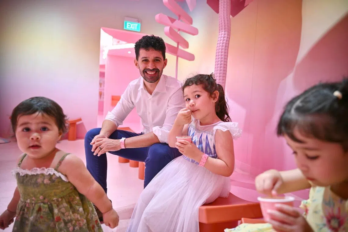 Tarek Amara with his daughters Yasmine (in white), four; Nawal (in yellow), three; and Tiziri (in green), one.