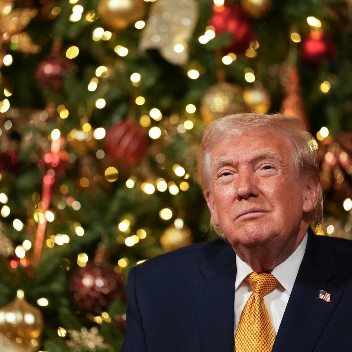 President Donald Trump takes part in NORAD Santa Calls and calls with service members on Christmas Eve at Mar-a-Lago in Palm Beach, Florida on Dec. 24, 2025.