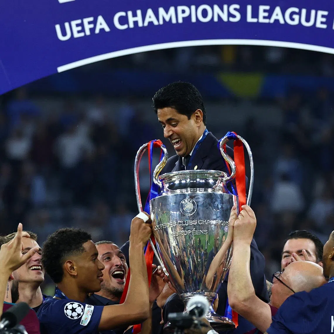Soccer Football - Champions League - Final - Paris St Germain v Inter Milan - Allianz Arena, Munich, Germany - May 31, 2025 Paris St Germain president Nasser Al-Khelaifi and their players celebrate after winning the Champions League REUTERS/Kai Pfaffenbach