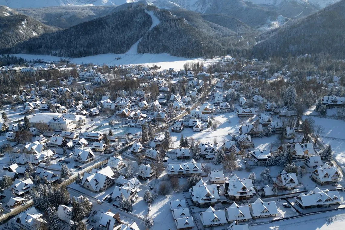 A residential area covered in snow, during a sunny winter day after heavy snowfall, in Zakopane, Poland, on Jan 12, 2026. 