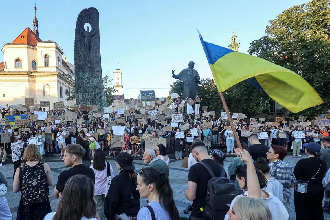 Ukrainians protest in the first wartime rally against a newly passed law, which curbs independence of anti-corruption institutions, amid Russia's attack on Ukraine, in central Lviv, Ukraine July 22, 2025. REUTERS/Roman Baluk