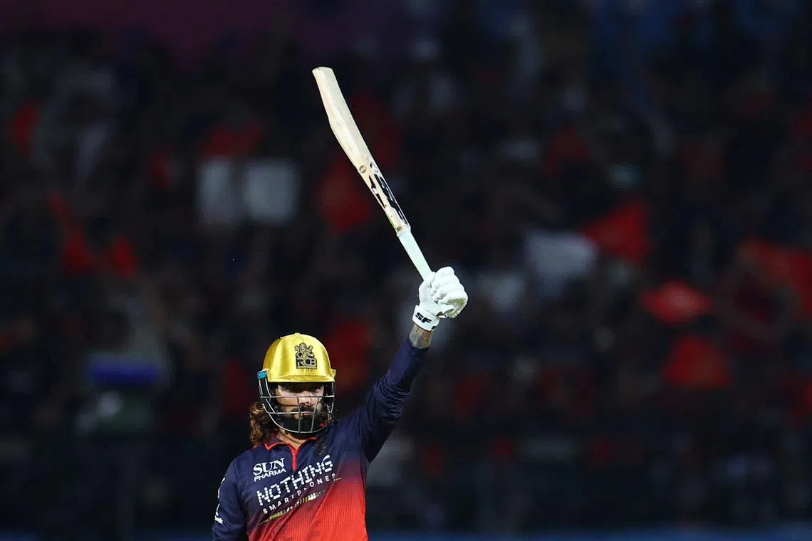 Cricket - Indian Premier League - IPL - Qualifier 1 - Royal Challengers Bengaluru v Gujarat Titans - Himachal Pradesh Cricket Association Stadium, Dharamshala, India - May 26, 2026  Royal Challengers Bengaluru's Rajat Patidar celebrates reaching his half century REUTERS/Anushree Fadnavis