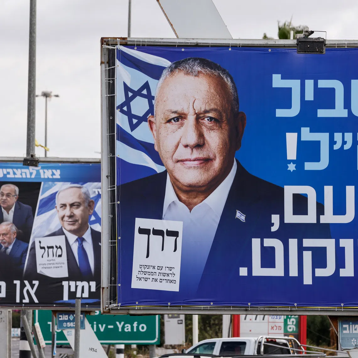 Billboards featuring Israeli Prime Minister Benjamin Netanyahu of the Likud party (left) and former Israeli military chief Gadi Eisenkot, leader of the Yashar party (right), at the entrance to Kiryat Malachi, Israel, October 20, 2026. The writing on Netanyahu's billboard reads \"right or Palestine\". The writing on Eisenkot's billboard reads \"for the IDF! This time, Eisenkot\". REUTERS/Amir Cohen