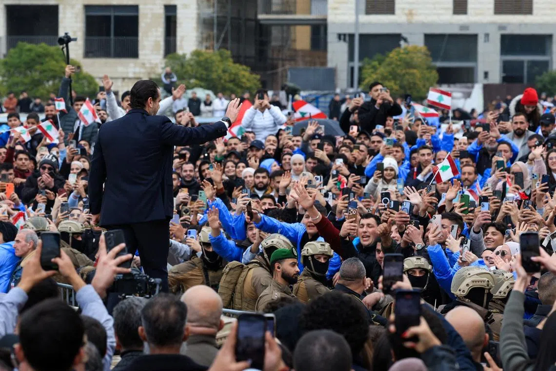 Saad Hariri gestures towards the gathered crowd during an event to mark the 21st anniversary of the assassination of his father and former Lebanese Prime Minister Rafik al-Hariri, in Beirut, Lebanon, February 14, 2026. REUTERS/Mohamed Azakir