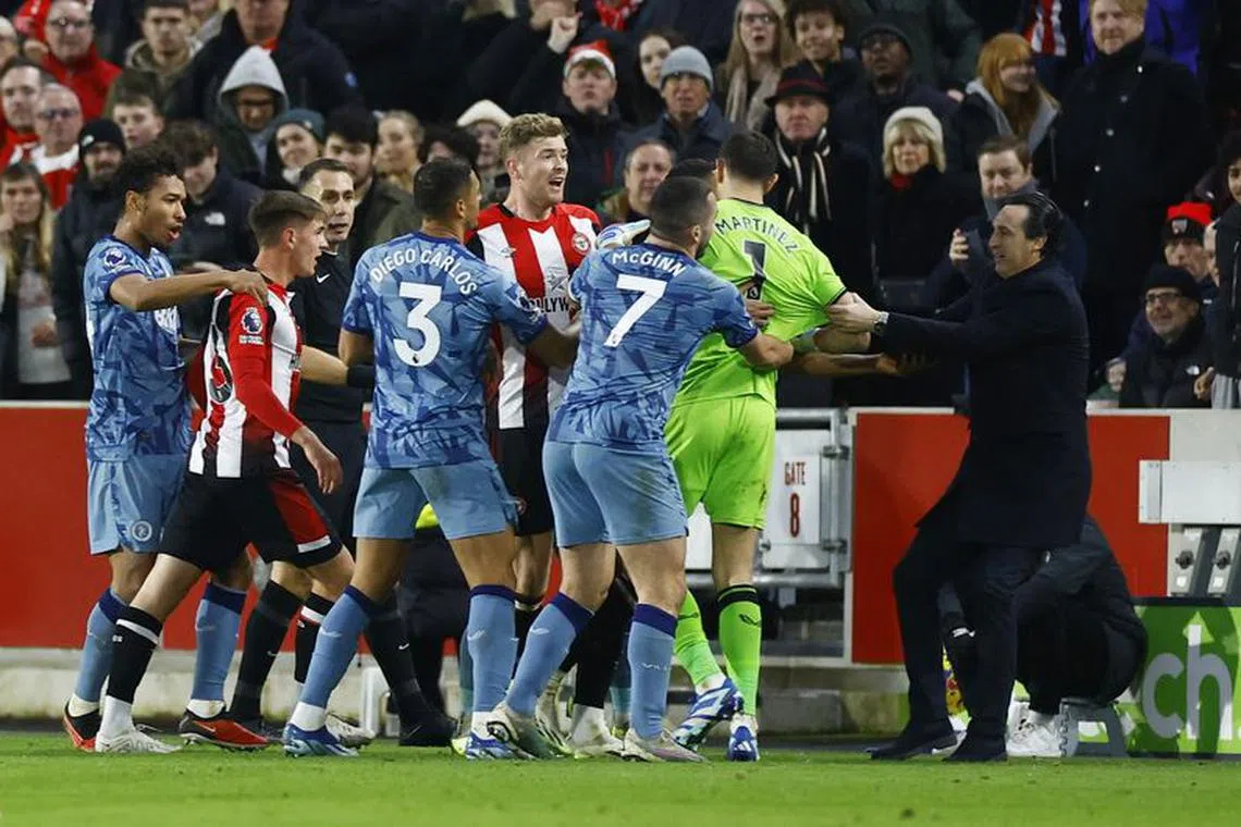FILE PHOTO: Soccer Football - Premier League - Brentford v Aston Villa - Brentford Community Stadium, London, Britain - December 17, 2023 Aston Villa's Emiliano Martinez clashes with Brentford's Nathan Collins as manager Unai Emery and teammates intervene Action Images via Reuters/Peter Cziborra/File Photo