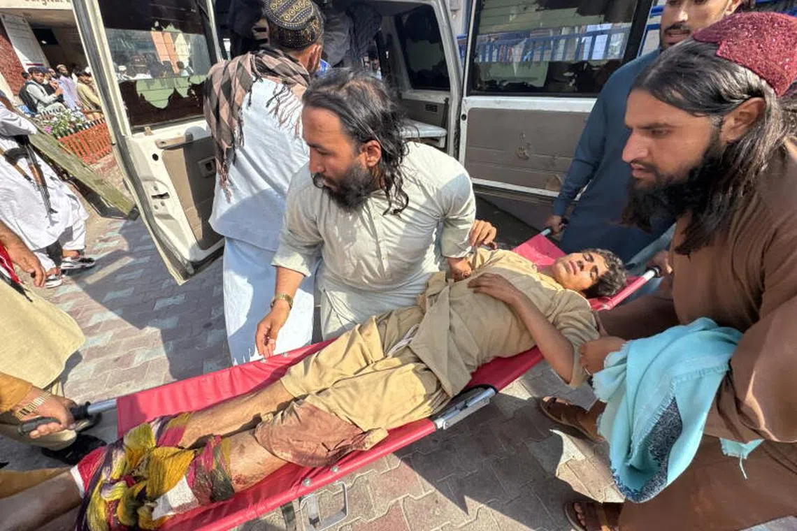 An injured victim of an earthquake is shifted to a hospital in Jalalabad, Afghanistan.