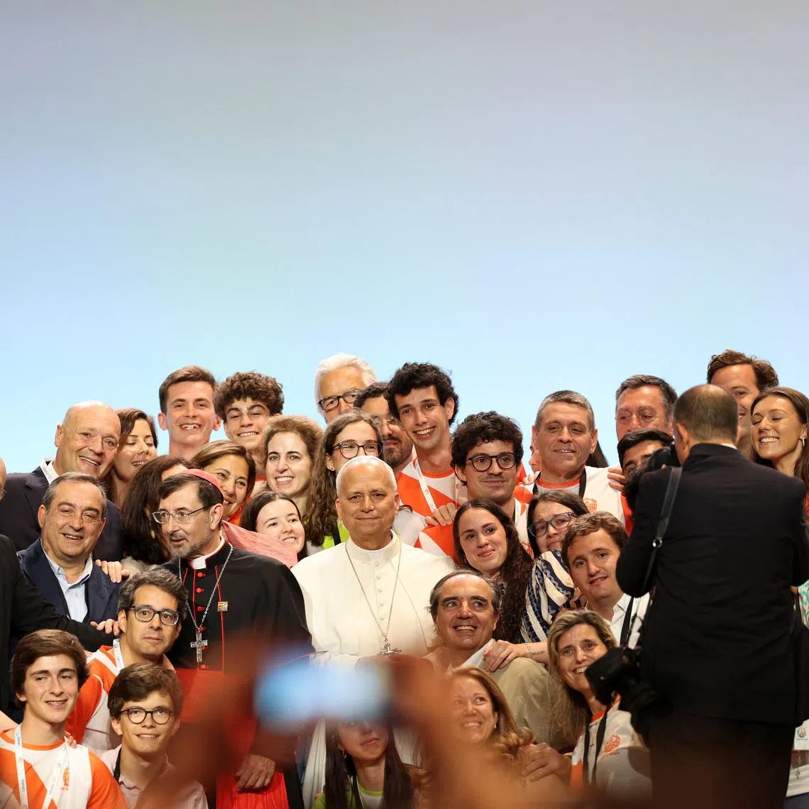 Pope Leo XIV poses for a photograph with with volunteers from the IFEMA centre during his apostolic journey in Madrid, Spain, June 9, 2026. REUTERS/Violeta Santos Moura