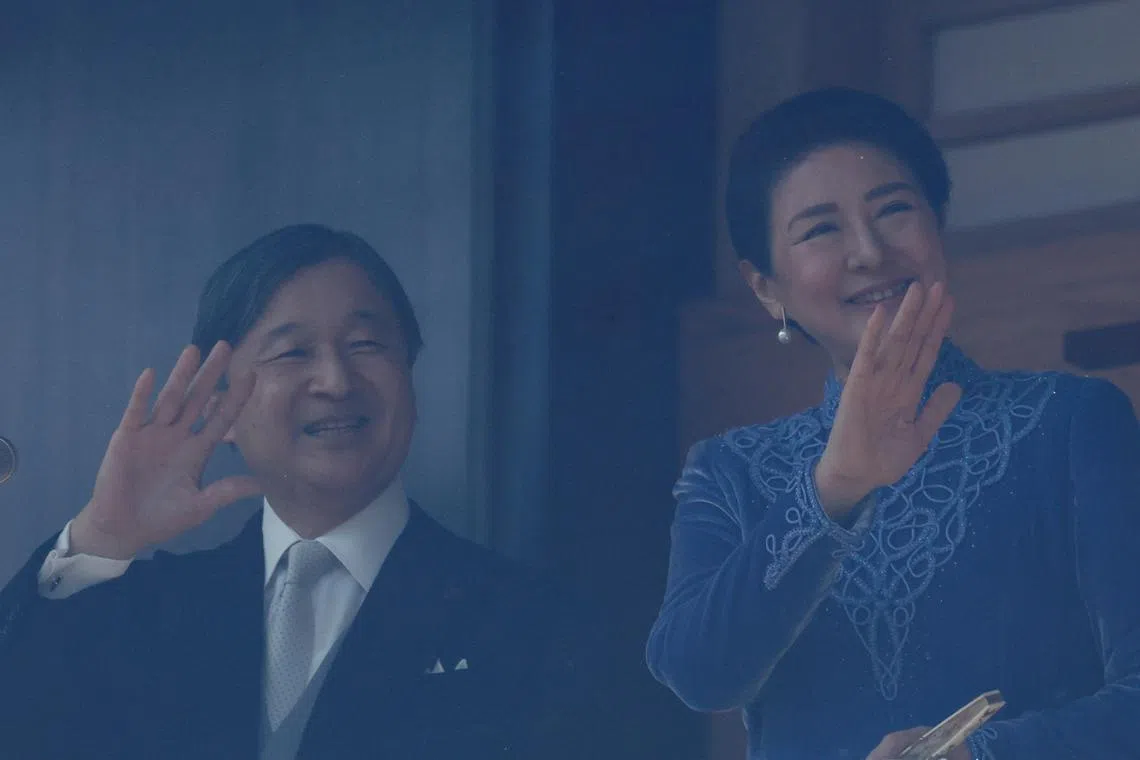 Japanese Emperor Naruhito and Empress Masako wave their hands to wellwishers from a balcony at the Imperial Palace in Tokyo, Japan February 23, 2025. REUTERS/Kim Kyung-Hoon 