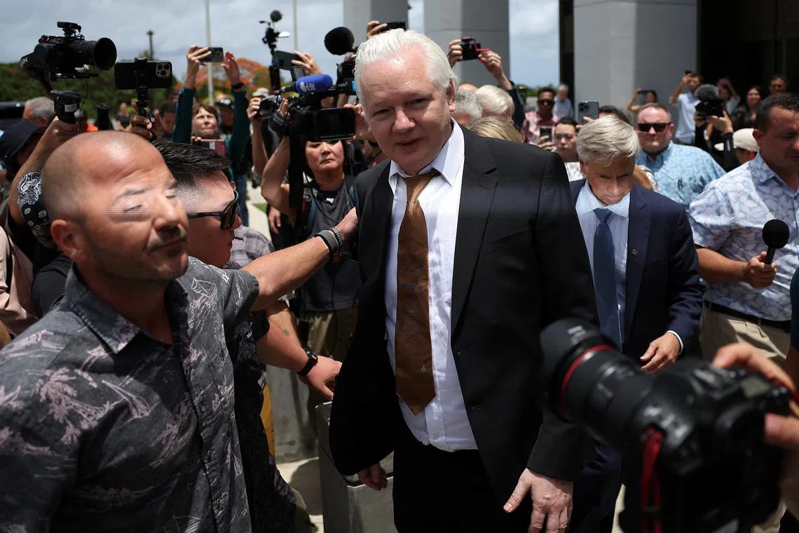 WikiLeaks founder Julian Assange walks outside United States District Court following a hearing, in Saipan, Northern Mariana Islands, on June 26, 2024.