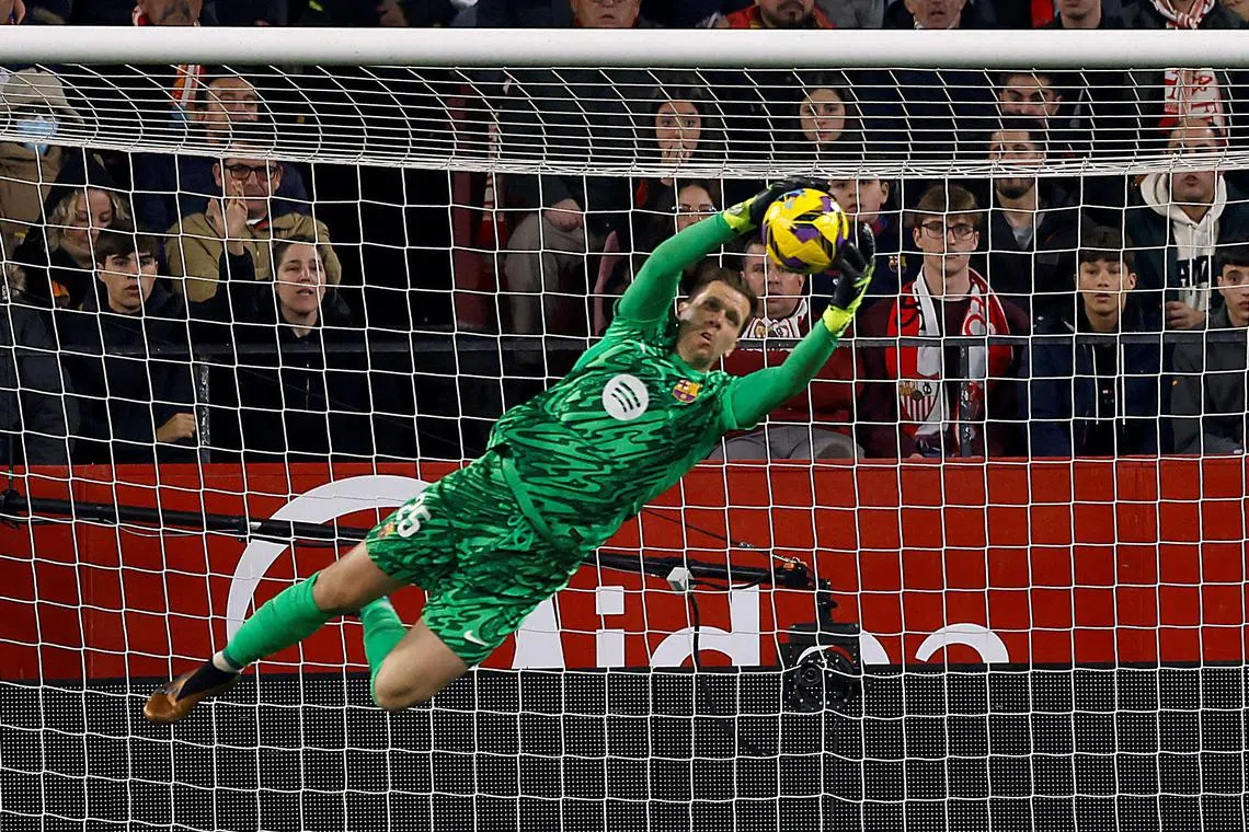 Barcelona's Wojciech Szczesny in action during a 4-1 La Liga win over Sevilla at the Ramon Sanchez Pizjuan on Feb 9.