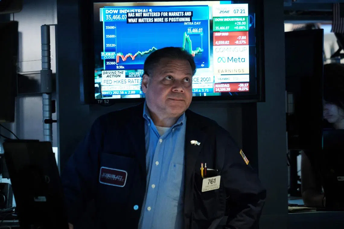 Traders work on the floor of the New York Stock Exchange, in New York City.