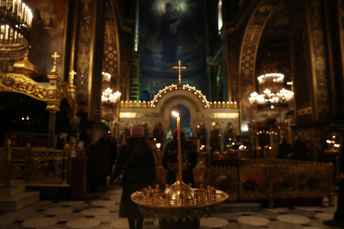 FILE PHOTO: People attend early morning Ukrainian Orthodox Church services, as Russia’s attack on Ukraine continues, at St Volodymyr's Cathedral in Kyiv, Ukraine, December 4, 2022. REUTERS/Shannon Stapleton/File Photo