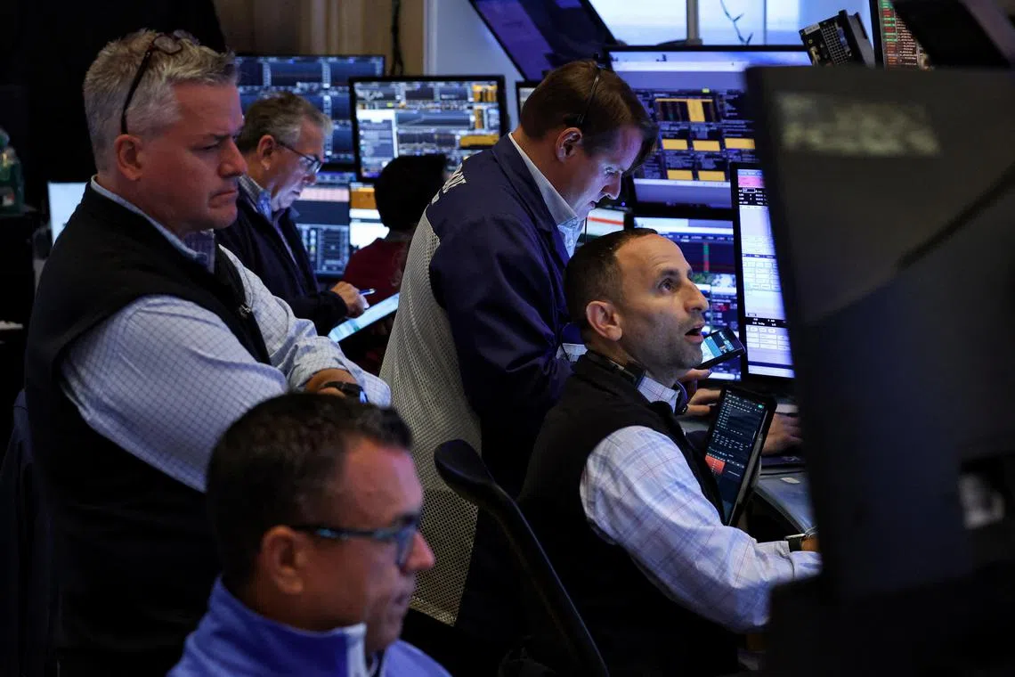 Traders work on the floor at the New York Stock Exchange (NYSE) in New York City, U.S., August 19, 2025.  REUTERS/Brendan McDermid      