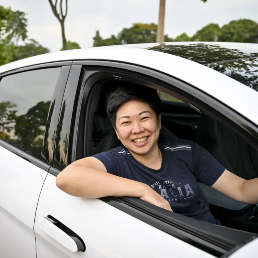 Ms Veronica Ong, 46, used to spend $600 a month on petrol. Now, she spends $150 a month charging her electric vehicle.