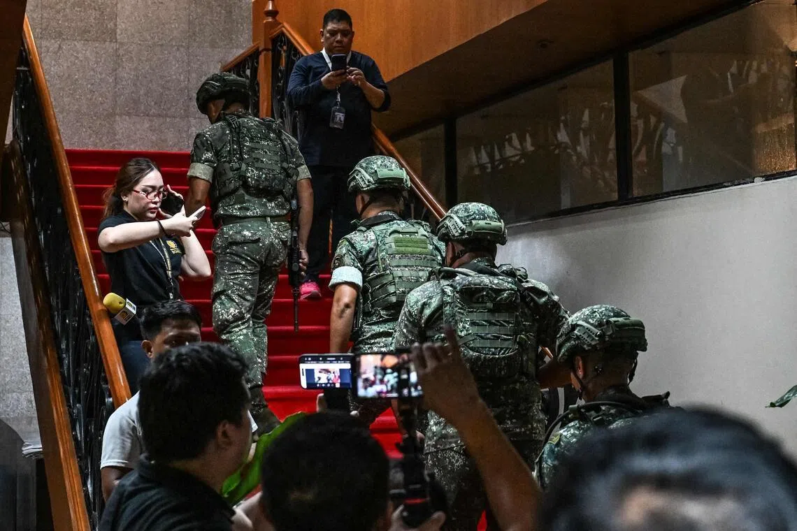 Troops arrive after the exchange of gunshots inside the Senate of the Philippines in Pasay, Metro Manila, on May 13.