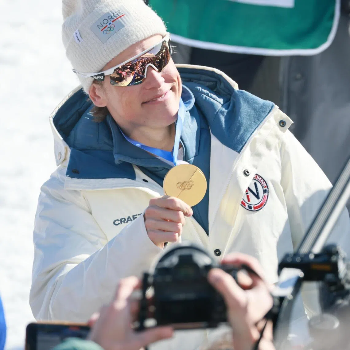 Norwegian cross-country skier Johannes Klaebo celebrating with his gold medal after leading his country to the 2026 Milano-Cortina Winter Olympics 4x7.5km relay team title in Tesero, Italy, on Feb 15, 2026. He is the first Winter Olympian to win nine gold medals.