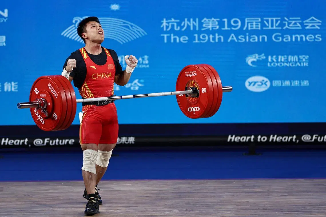 Asian Games - Hangzhou 2022 - Weightlifting - Xiaoshan Sports Centre Gymnasium, Hangzhou, China - October 1, 2023
China's Chen Lijun reacts during the Men's 67Kg Weightlifting Group A REUTERS/Ann Wang