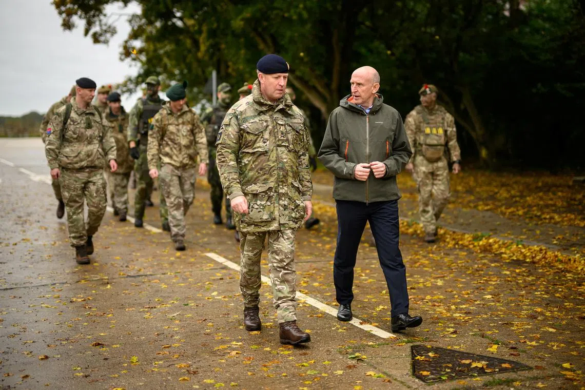 British Defence Secretary John Healey speaks with soldiers and staff at the Stanford Training Area on October 20, 2024 near Thetford, Britain. Leon Neal/Pool via REUTERS