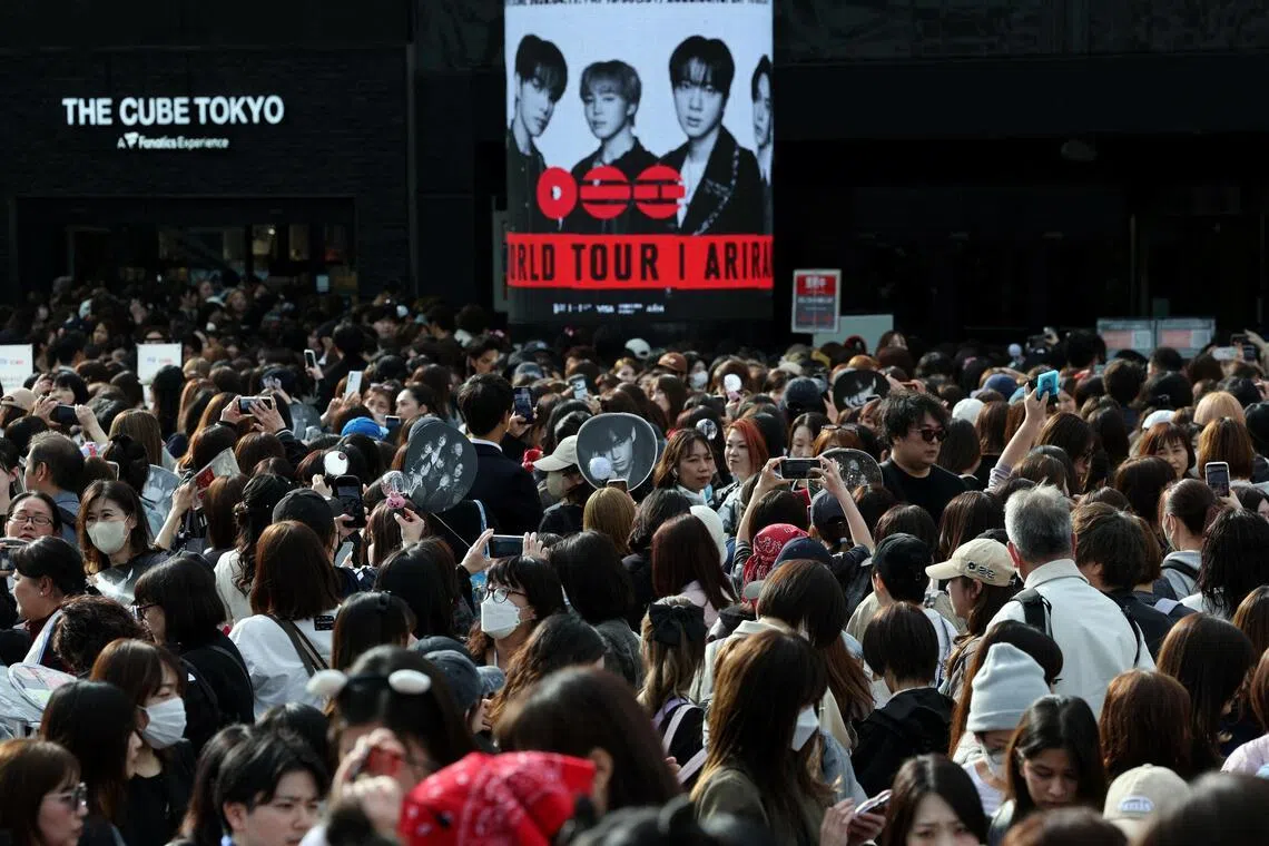 Fans of South Korean K-pop boy band BTS throng around the Tokyo Dome before the start of the band's BTS World Tour Arirang concert in  Japan on April 17.