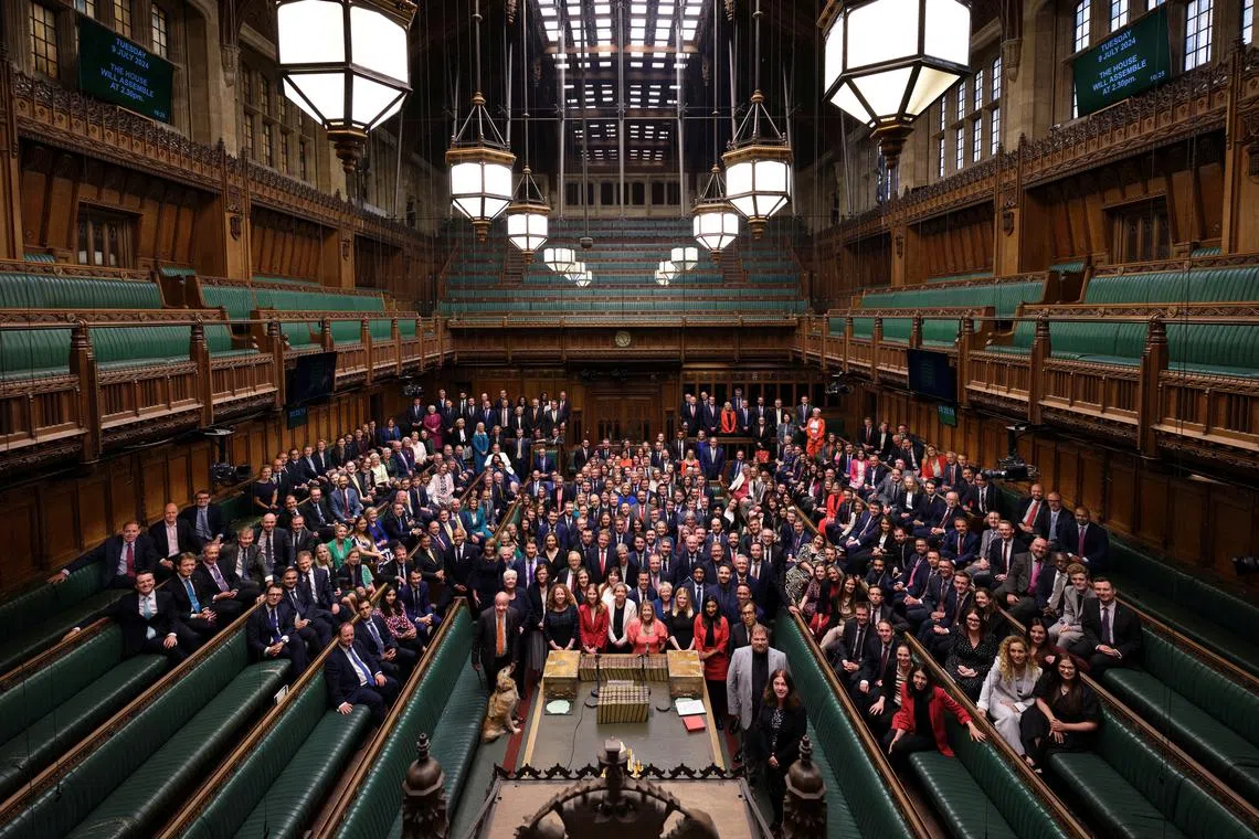 British Members of Parliament, newly elected in the 2024 general election, gather in the House of Commons Chamber for a group photo in London, Britain July 9, 2024 in this handout image. UK Parliament/Handout via REUTERS/ File Photo