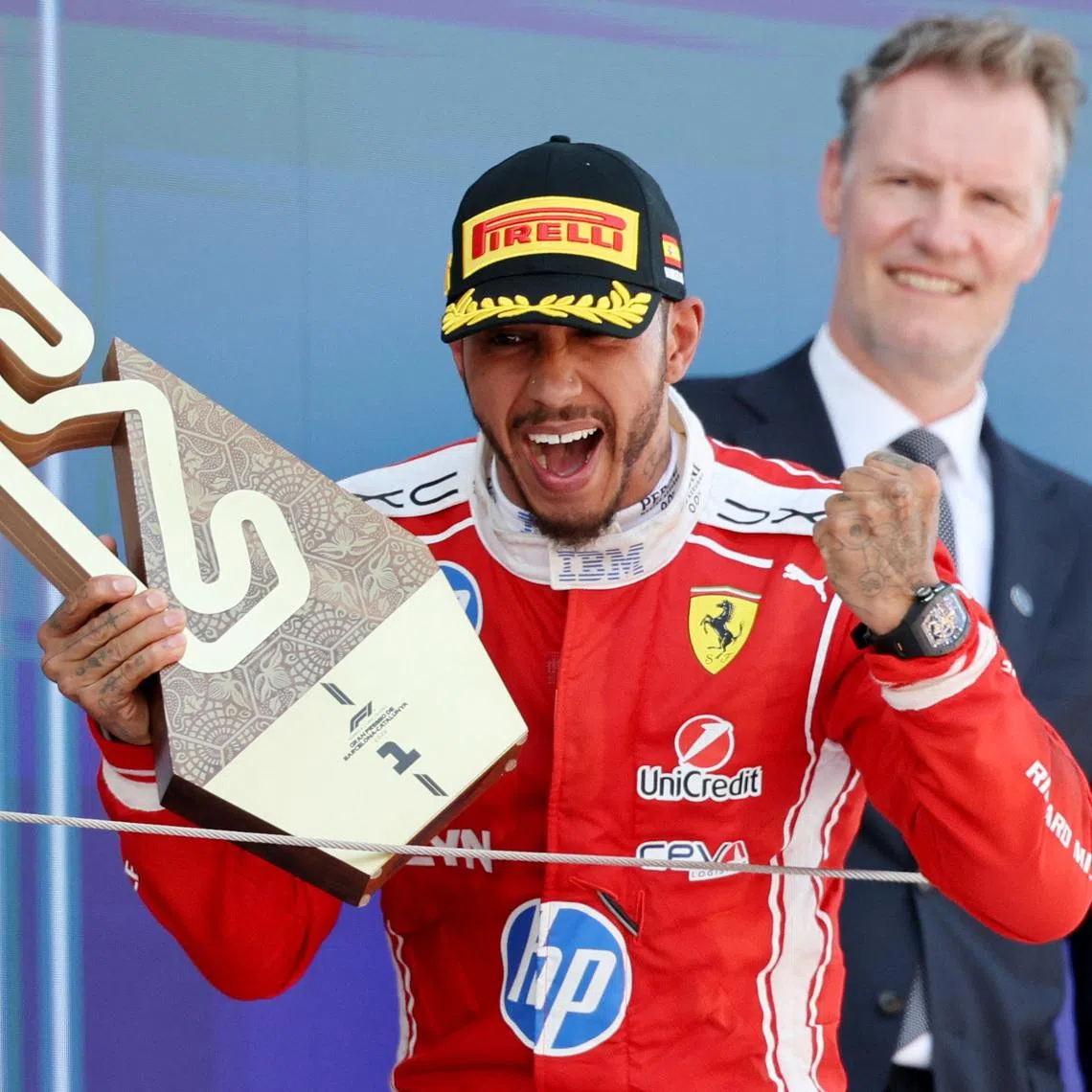 Formula One F1 - Barcelona-Catalunya Grand Prix - Circuit de Barcelona-Catalunya, Barcelona, Spain - June 14, 2026 Ferrari's Lewis Hamilton celebrates with a trophy after winning the Barcelona-Catalunya Grand Prix REUTERS/Nacho Doce