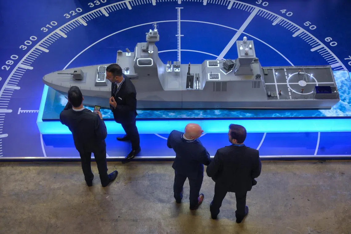 Visitors seen at the Israel Aerospace Industries booth at IMDEX Asia at the Changi Exhibition Centre, on May 3, 2023.