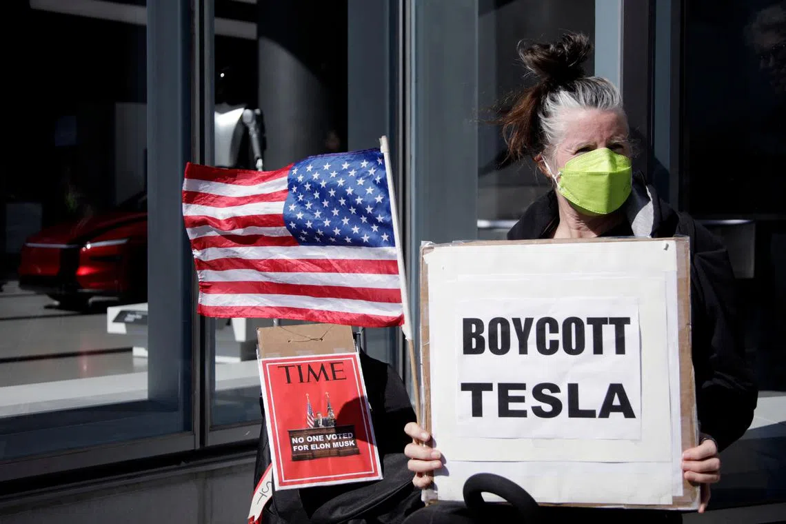 The protest was one of a wave of “Tesla Takedown” demonstrations staged across the country targeting billionaire Elon Musk.