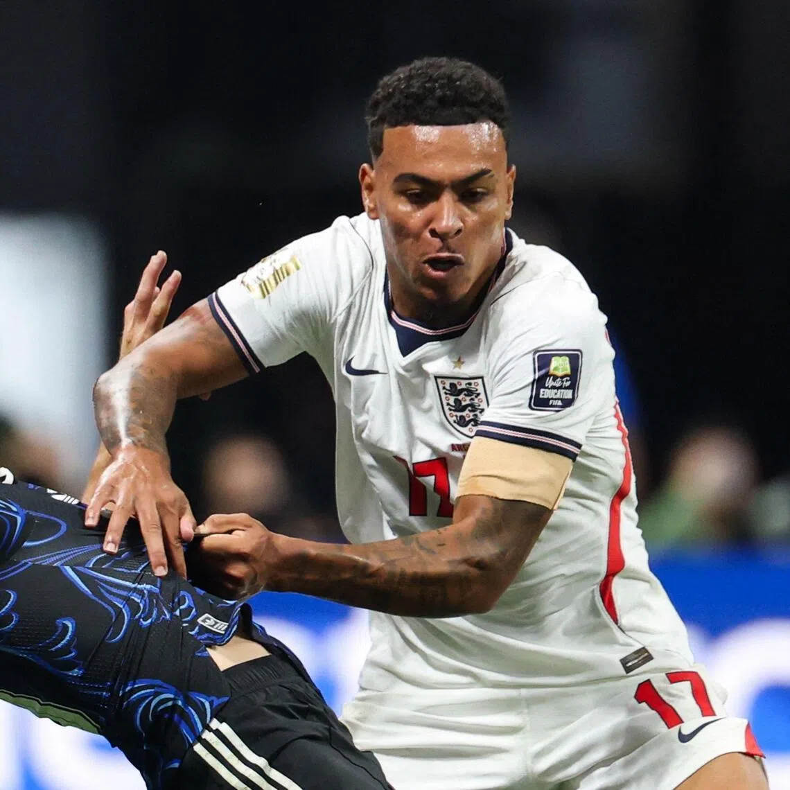 Midfielder Morgan Rogers (right) and defender Nicolas Tagliafico fighting for the ball during the 2026 World Cup semi-final between England and Argentina on July 15.