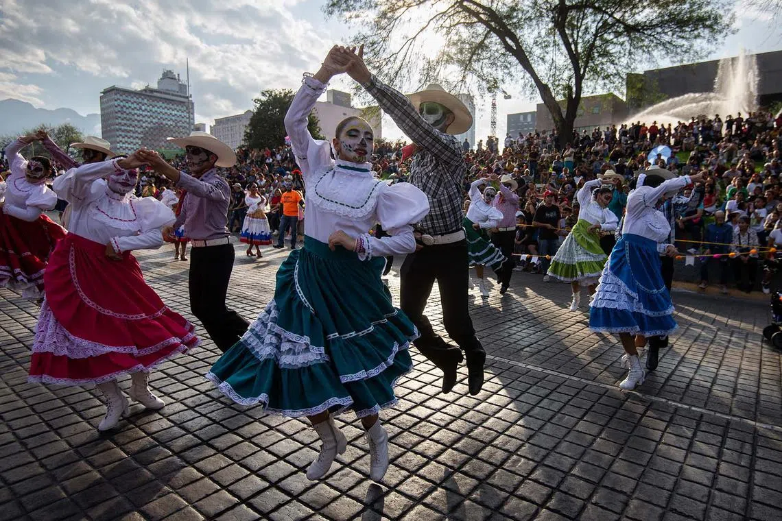 Participants dressed as Catrinas dance during a procession as part of the Day of the Dead celebrations in Monterrey, Mexico, Oct 29.