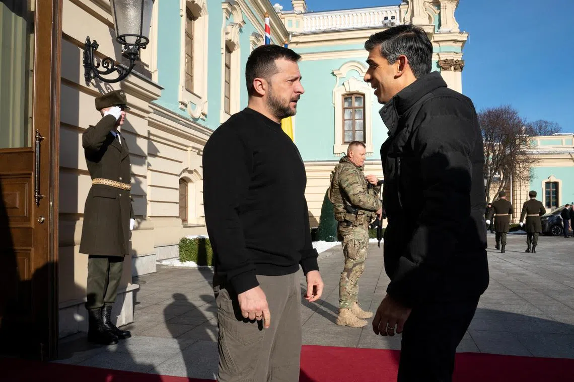 Ukrainian President Volodymyr Zelensky (left) greets Prime Minister Rishi Sunak at the Presidential Palace in Kyiv.
