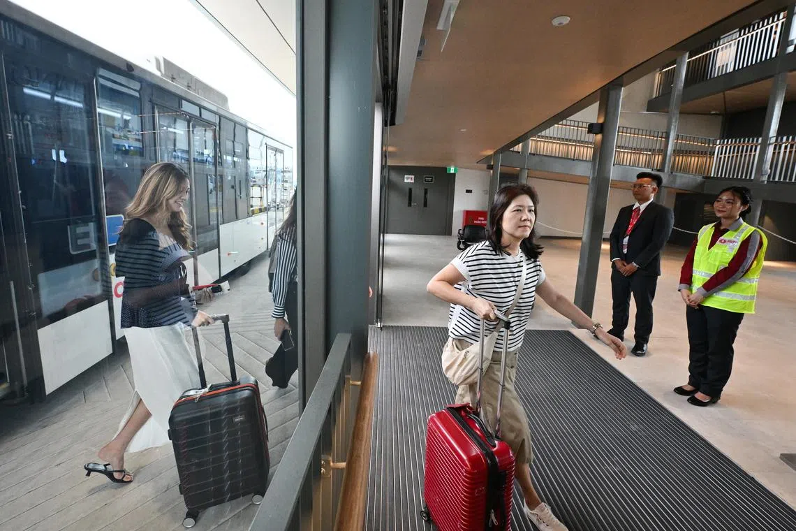 Passengers alighting bus and arrives at Changi Airport’s satellite gate.