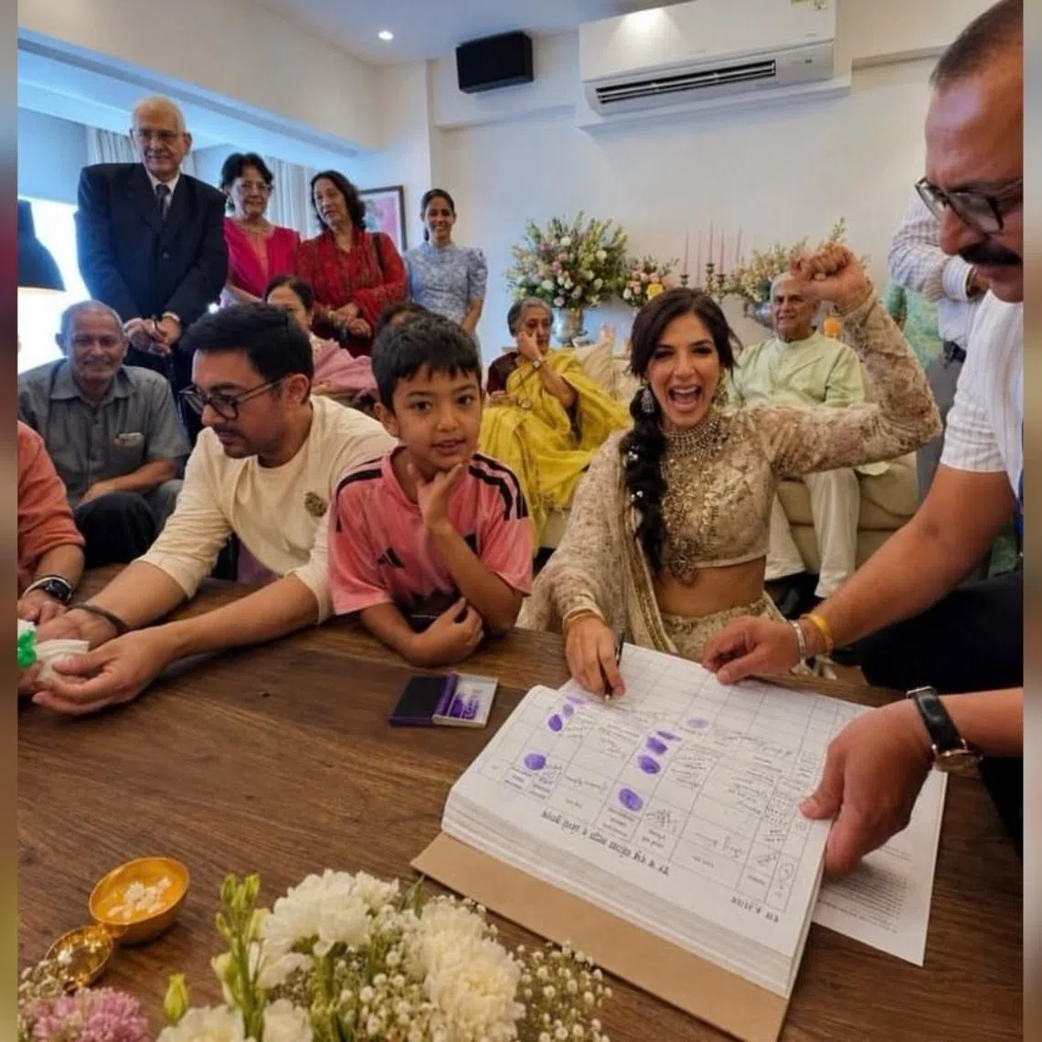 Aamir Khan (sitting, in white) and Gauri Spratt (with hand raised) tied the knot on July 5.