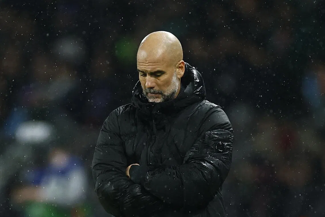 FILE PHOTO: Soccer Football - Champions League - Paris St Germain v Manchester City - Parc des Princes, Paris, France - January 22, 2025 Manchester City manager Pep Guardiola reacts REUTERS/Stephanie Lecocq/File Photo