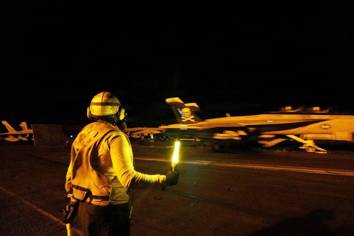 American sailors conducting night-time flight operations while transiting the Arabian Sea, in a photo posted online by the US military.