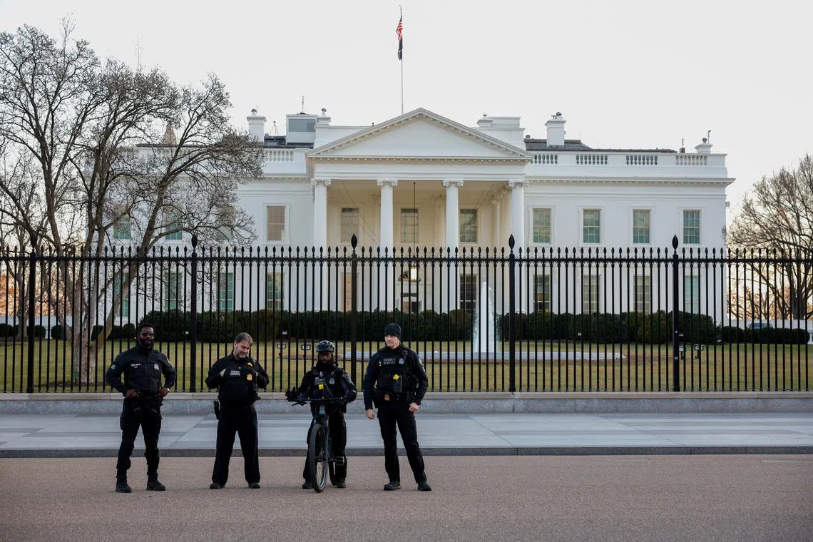FILE PHOTO: U.S. Secret Service Police stand guard outside the White House in Washington, U.S., January 28, 2023. REUTERS/Tasos Katopodis/File Photo