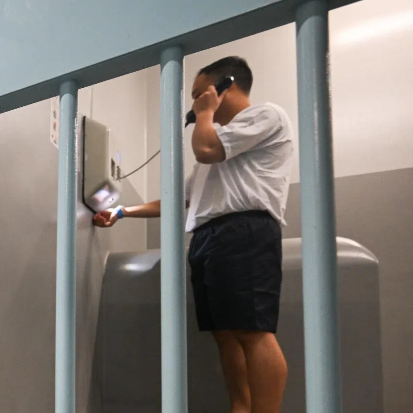 An inmate’s journey starts after he is taken from a courtroom into a holding area at the State Courts.