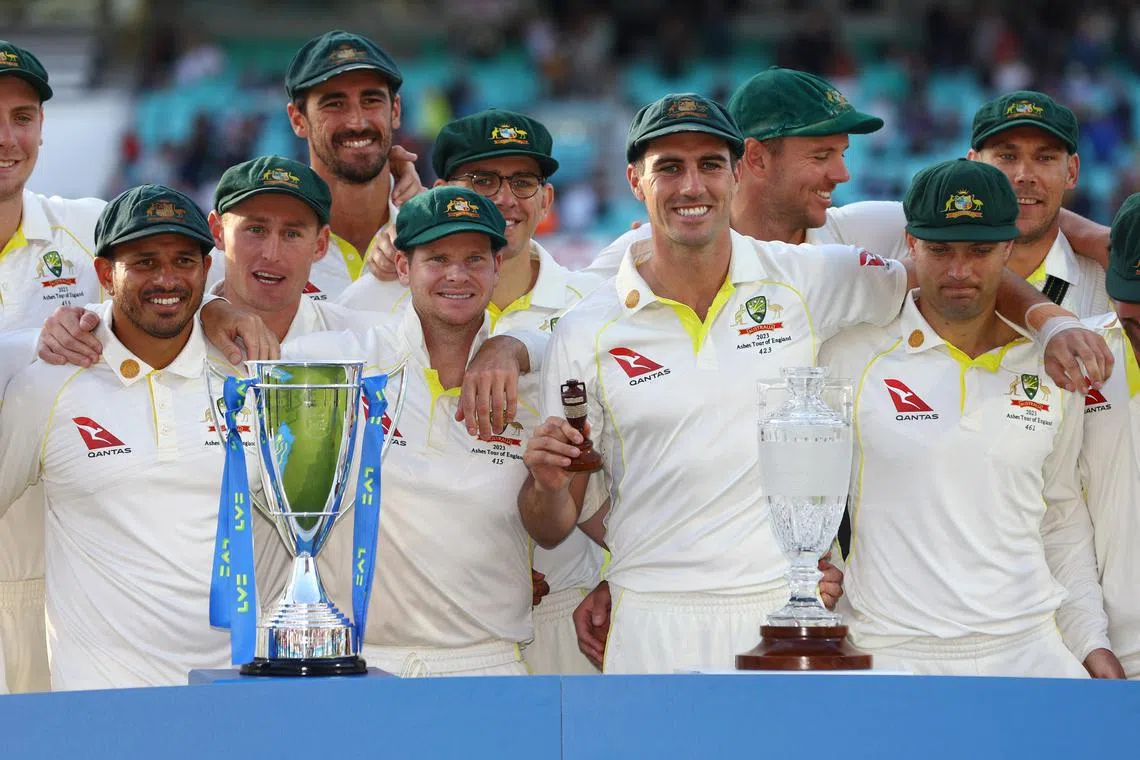 FILE PHOTO: Cricket - Ashes - Fifth Test - England v Australia - The Oval, London, Britain - July 31, 2023 Australia's Pat Cummins and teammates pose with the urn and trophies after drawing the series and retaining the Ashes Action Images via Reuters/Paul Childs/File Photo