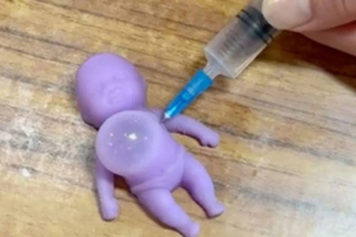 The product is marketed as a stress-relieving item, where a syringe is used to inject air into a squishy toy which then create a blister-like bulge that can be squeezed or popped. 