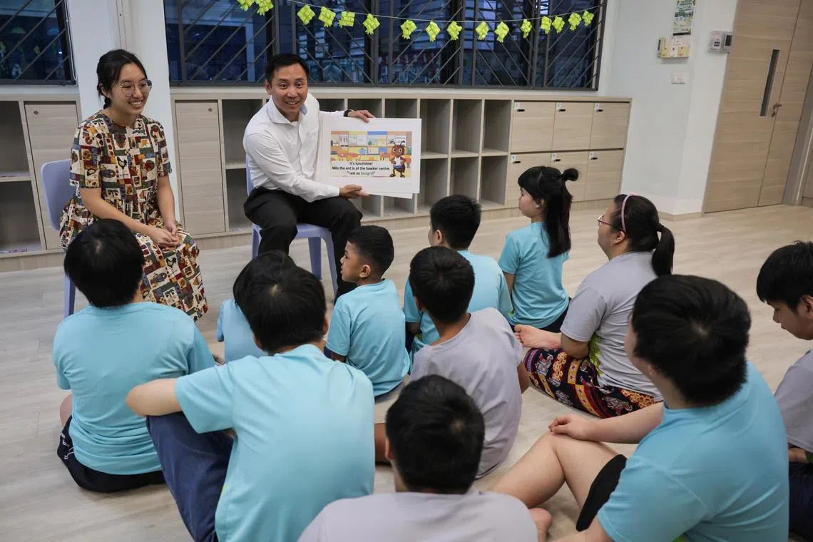 Minister of State for Social and Family Development Goh Pei Ming (right) joins students of MINDS Woodlands Gardens School for part of a storytelling session on March 25.