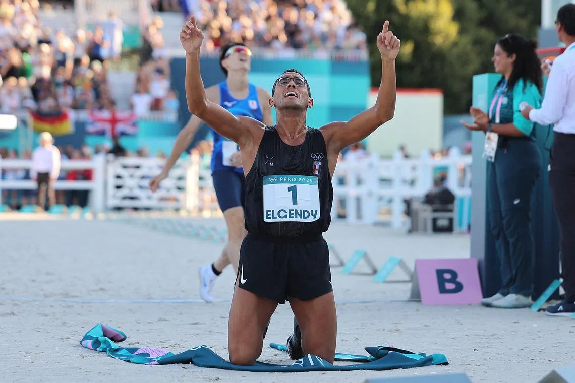 Paris 2024 Olympics - Modern Pentathlon - Men's Final Laser Run - Chateau de Versailles, Versailles, France - August 10, 2024. Ahmed Elgendy of Egypt celebrates winning the gold medal. REUTERS/Zohra Bensemra