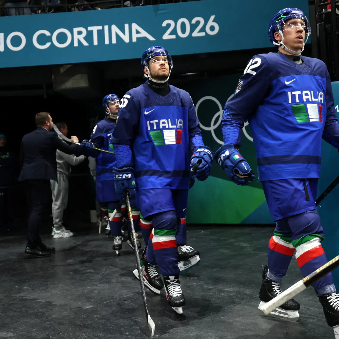 FILE PHOTO: Milano Cortina 2026 Olympics - Ice Hockey - Men's Preliminary Round - Group B - Sweden vs Italy - Milano Santagiulia Ice Hockey Arena, Milan, Italy - February 11, 2026. Diego Kostner of Italy and Luca Zanatta of Italy before the match REUTERS/Mike Segar/File Photo