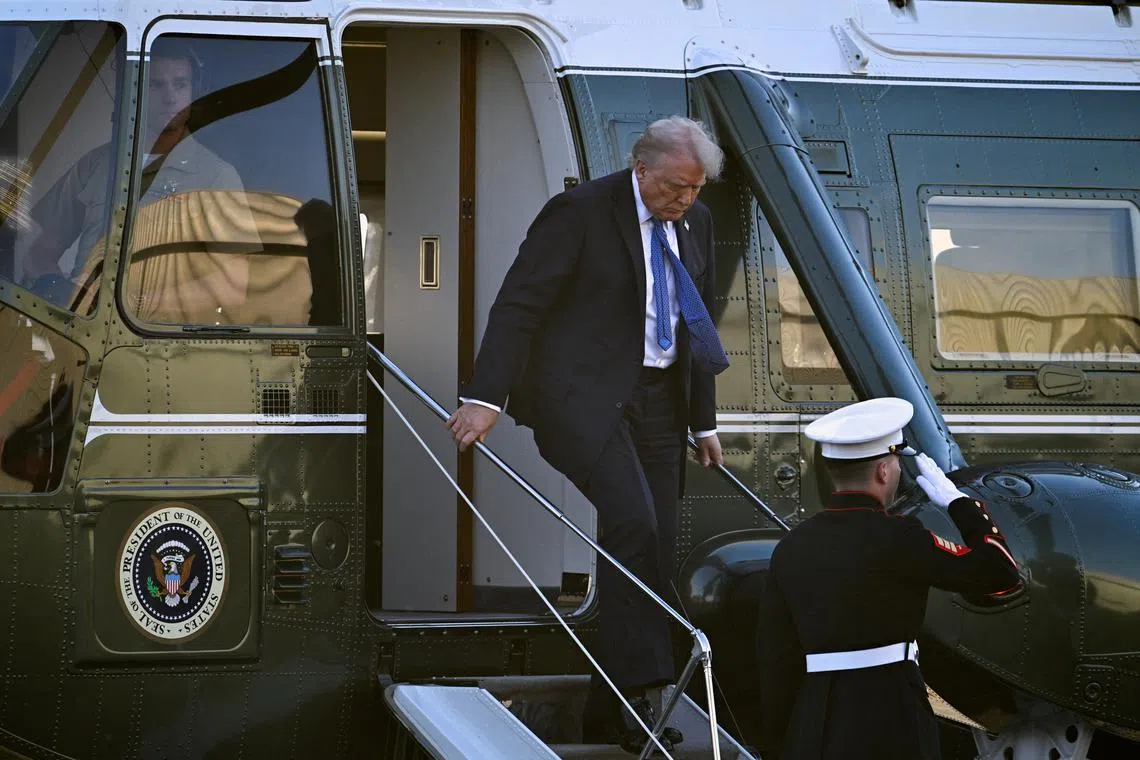 U.S. President Donald Trump disembarks Marine One as he arrives at Leesburg Executive Airport in Leesburg, Virginia, U.S., April 24, 2025. REUTERS/Craig Hudson