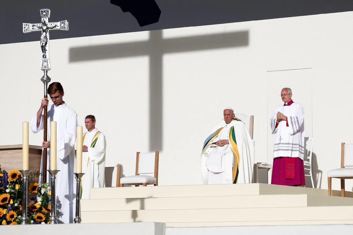 Pope Francis holds a Holy Mass at King Baudouin Stadium in Brussels, Belgium, September 29, 2024. REUTERS/Guglielmo Mangiapane
