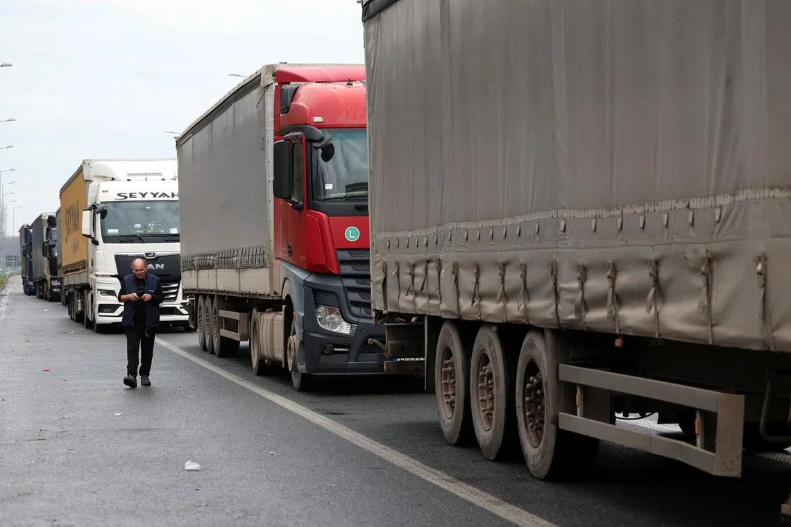A truck driver walks during a protest by truck drivers and transport union representatives at the Serbia-Croatia border crossings, citing disruptions linked to the European Union's new Entry-Exit System (EES), in Batrovci, Serbia, January 26, 2026. REUTERS/Zorana Jevtic