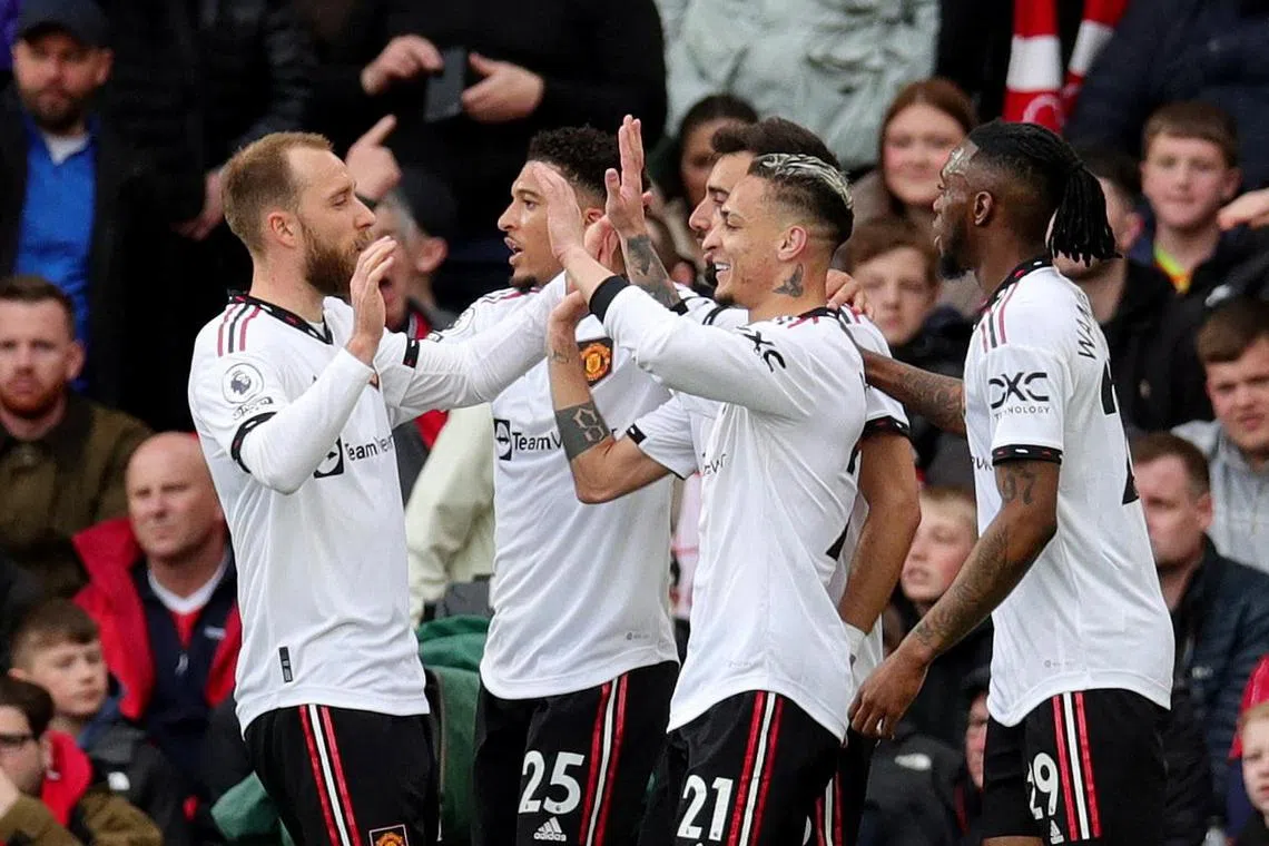 Manchester United's Antony celebrates scoring their first goal with Jadon Sancho, Bruno Fernandes, Christian Eriksen and Aaron Wan-Bissaka.