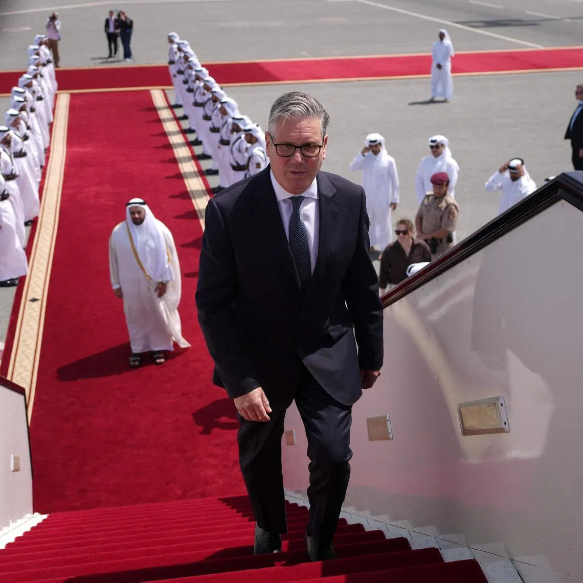 Prime Minister Keir Starmer boarding a plane in Doha, Qatar, after a three-day trip to the Gulf.
