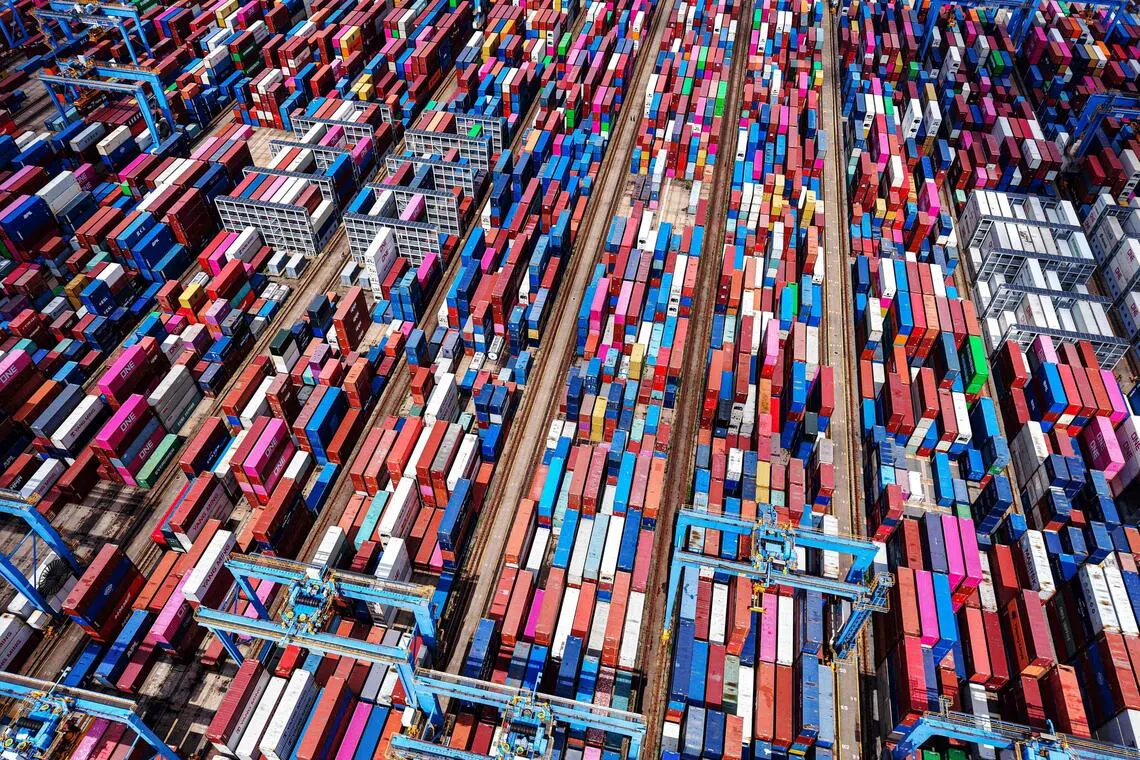 This picture shows an aerial view of shipping containers stacked at a port in Qingdao, in eastern China's Shandong province on September 4, 2025. (Photo by AFP) / China OUT