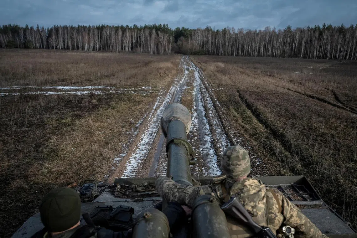 Ukrainian servicemen attend a drill of armed forces at the border with Belarus, on Feb 2, 2023. 