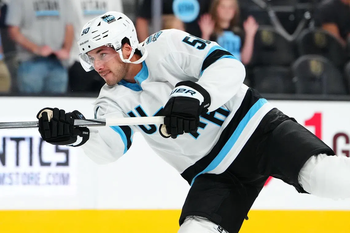 FILE PHOTO: Sep 27, 2024; Las Vegas, Nevada, USA; Utah Hockey Club defenseman Sean Durzi (50) warms up before a game against the Vegas Golden Knights at T-Mobile Arena. Mandatory Credit: Stephen R. Sylvanie-Imagn Images/File Photo