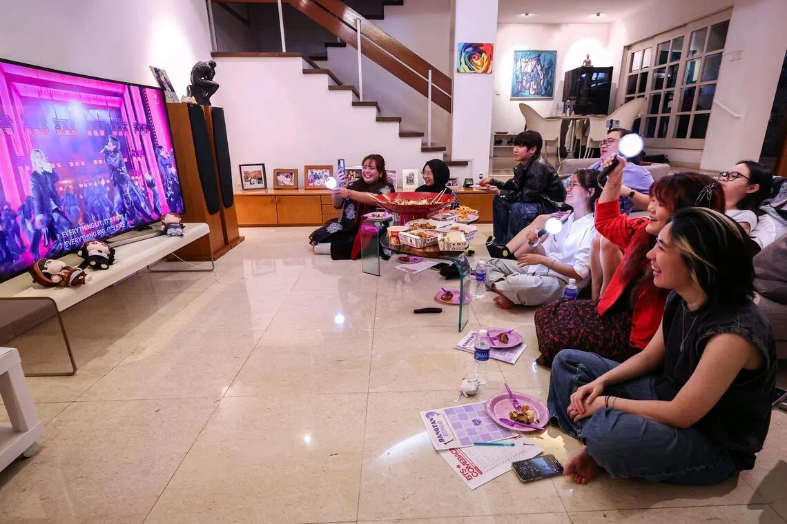 BTS fans gathering at a semi-detached house in the Bukit Timah area to watch the BTS The Comeback Live: Arirang concert on Netflix on March 21.
